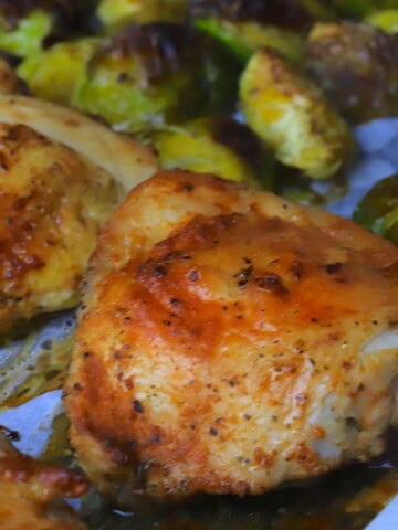 Roasted brussels sprouts with baked chicken thighs.